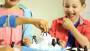 Ravensburger 21325 - Plitsch Platsch Pinguin - großer Spielspaß mit Geschicklichkeitsfaktor für Kind
